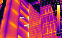 Thermal infrared image of a building façade showing heat-loss patterns during a building envelope investigation.